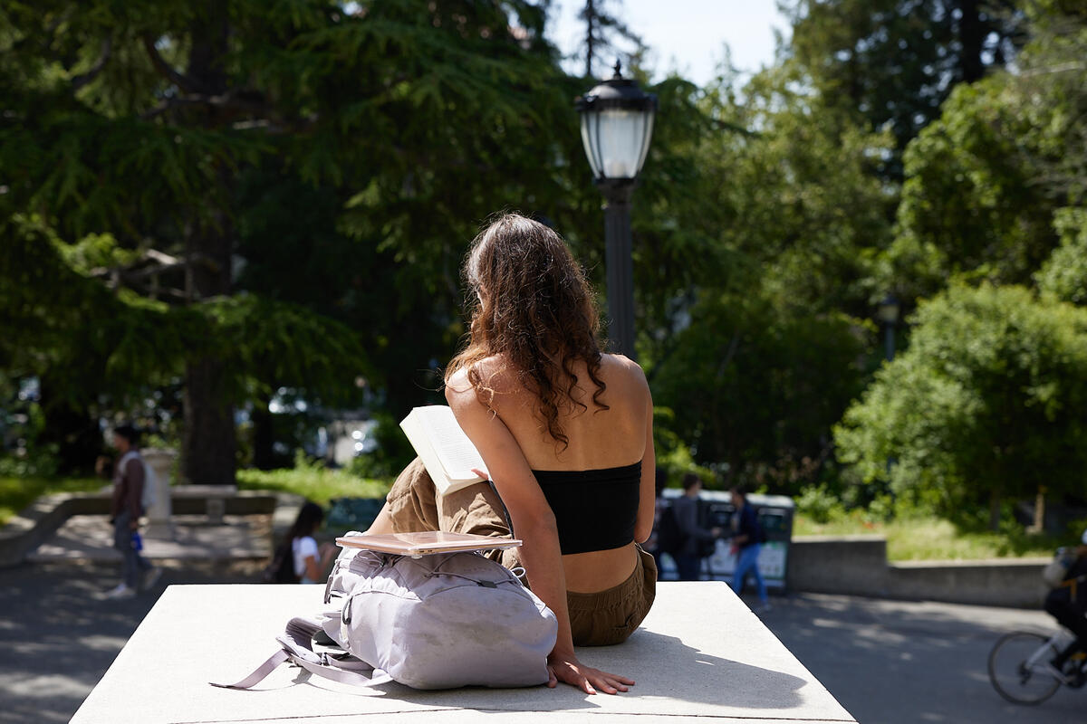 Student Reading on Campus
