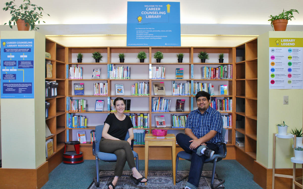 Career Counselors sitting in front of books available at the Career Library