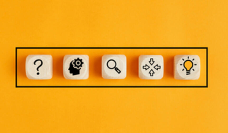 Scrabble tiles with icons related to understanding things like a lightbulb