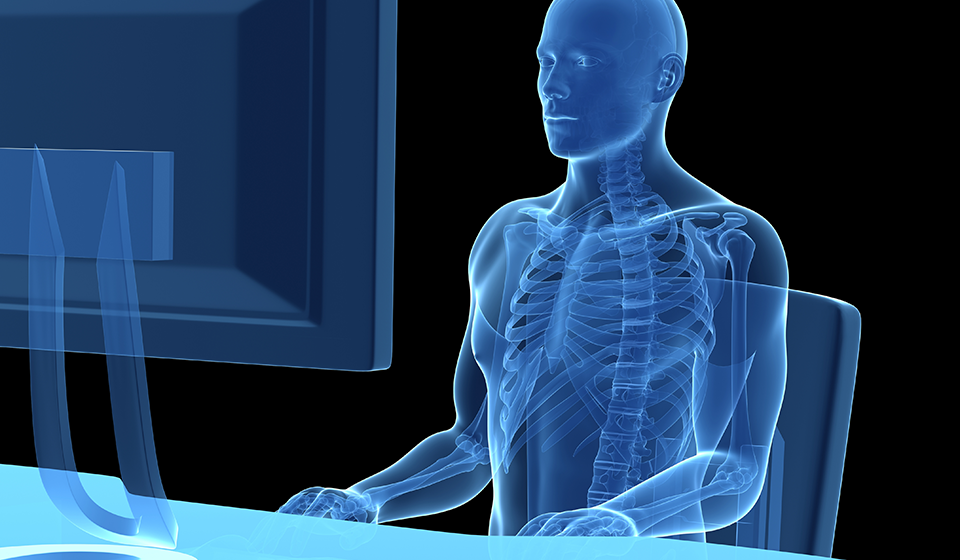 Outline of a person highlighted in neon blue sitting at a computer workstation