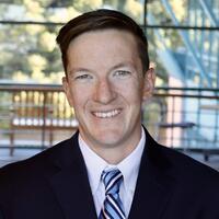 An Associate Team Physician is pictured