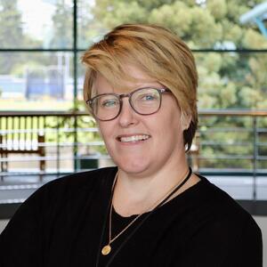 A headshot of a nurse practitioner